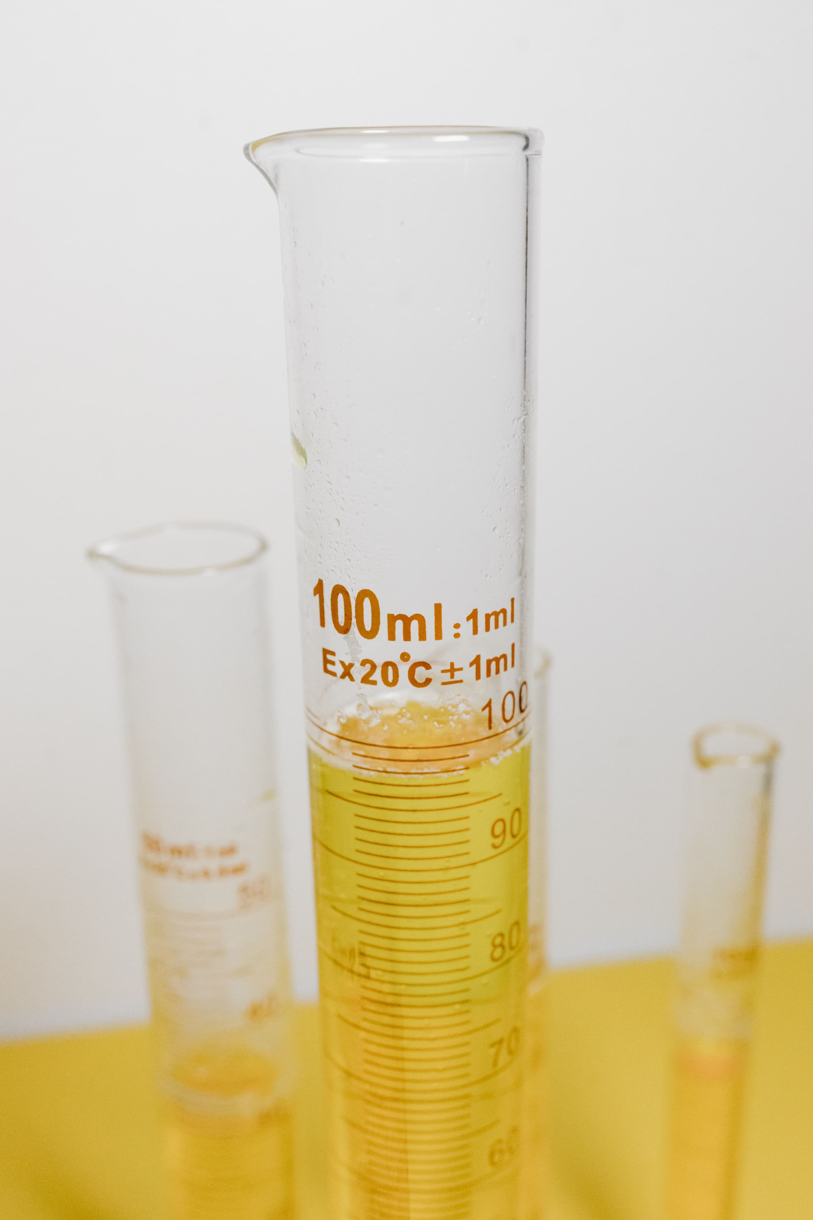 Graduated cylinder with yellow liquid